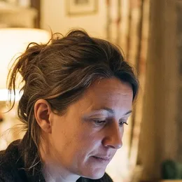 Claire, on her couch, in the evening